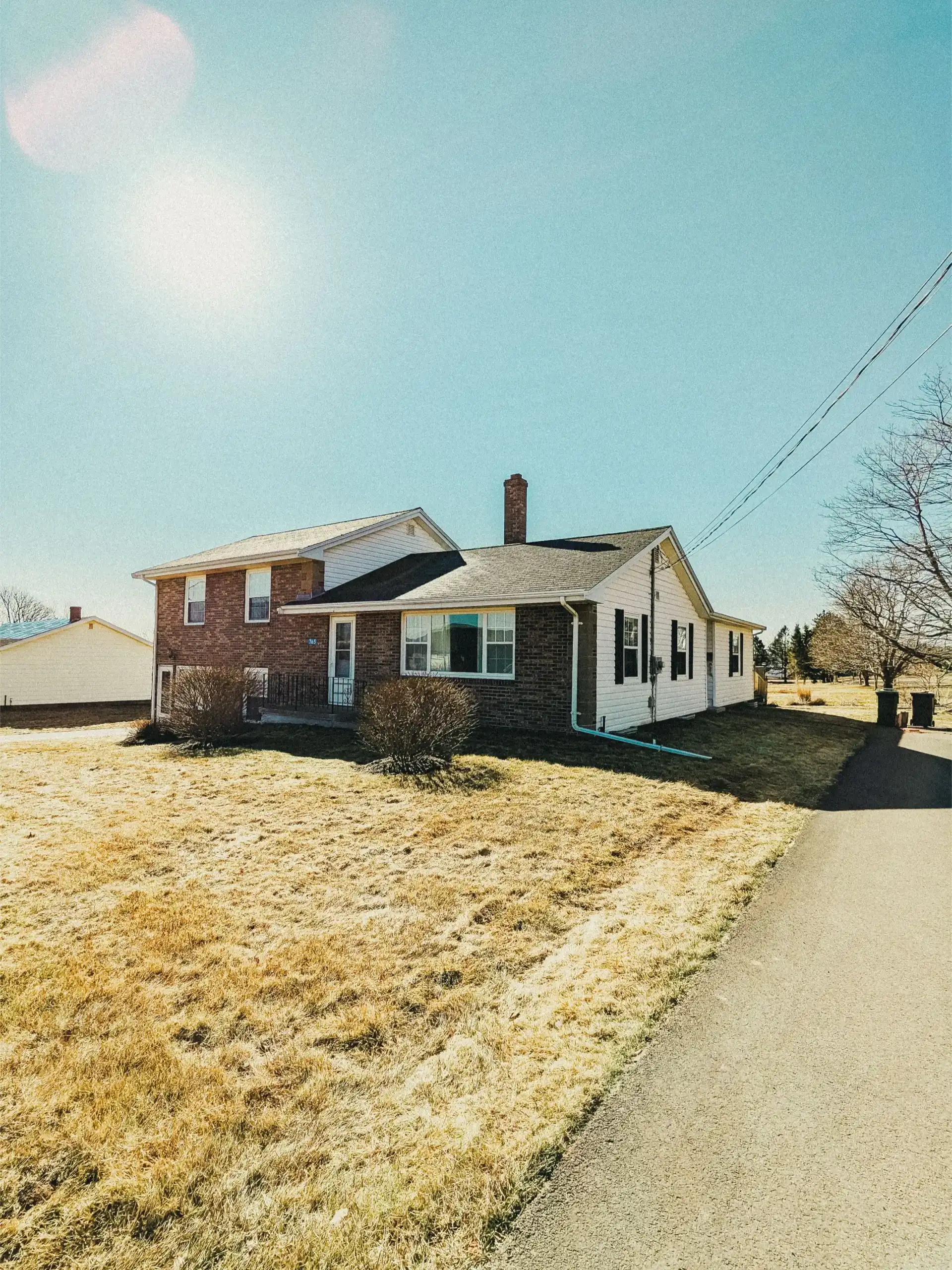 Red brick house with a lawn
